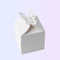 White single cake box with butterfly closure, angled view